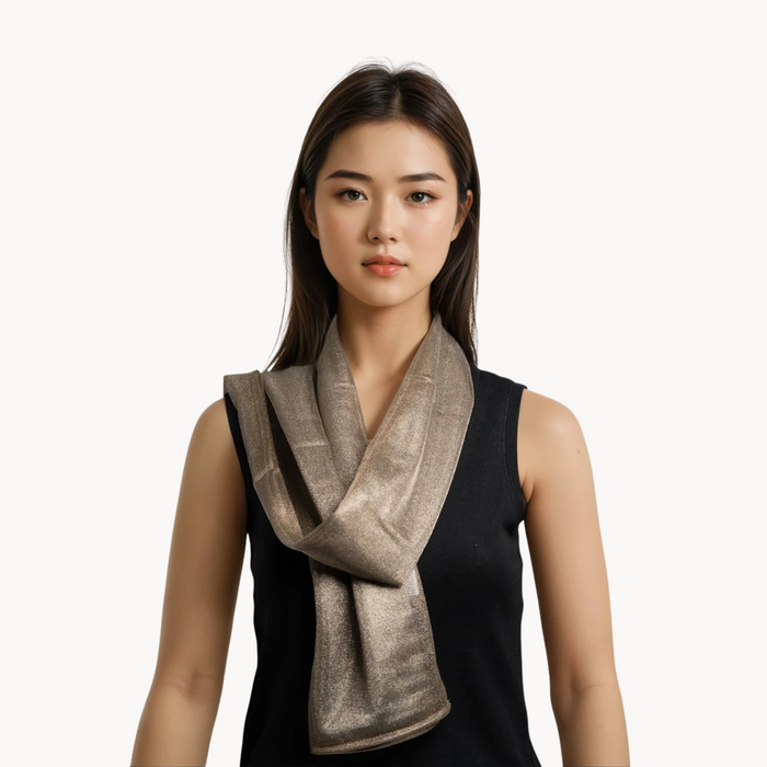 Woman wearing a silver emf 5g shielding headscarf on a white background