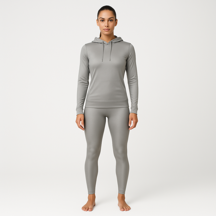 Woman wearing a grey silver gray emf 5g shielding hoodie on a white background