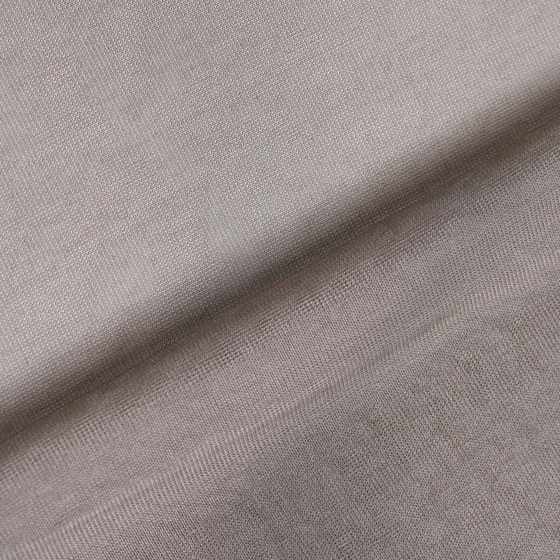 WOREMOR® SilverWeave silver conductive mesh shielding fabric shown flat on surface