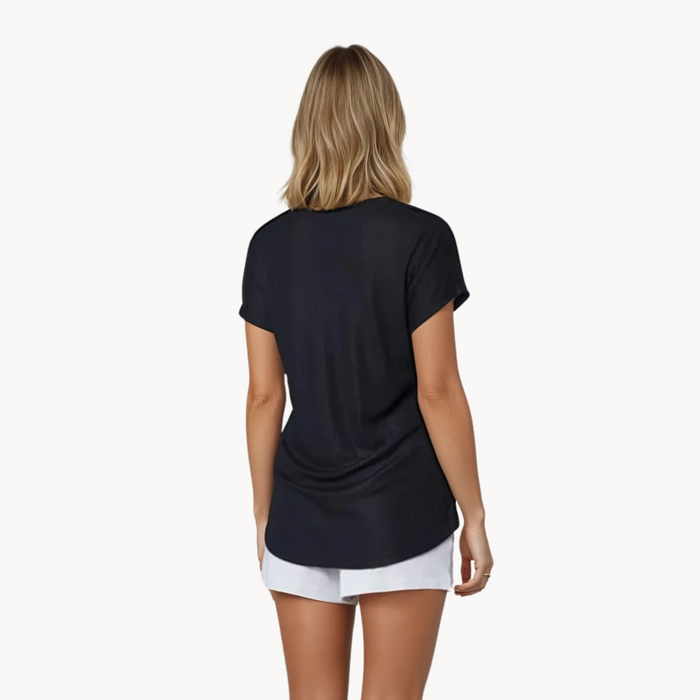EMF shielding t-shirt – back view of WOREMOR EMF 5G protection black shirt worn by woman with white short