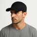 Male model wearing the WOREMOR Silver EMF Protection Cap in black