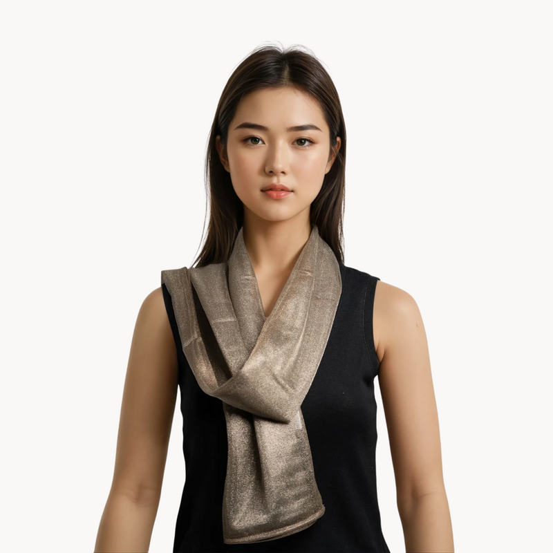 Woman wearing a silver emf 5g shielding headscarf on a white background