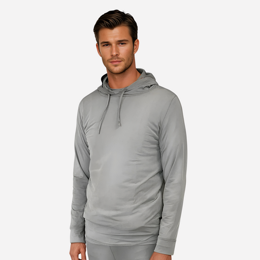 Man wearing a grey silver gray emf 5g shielding hoodie on a white background