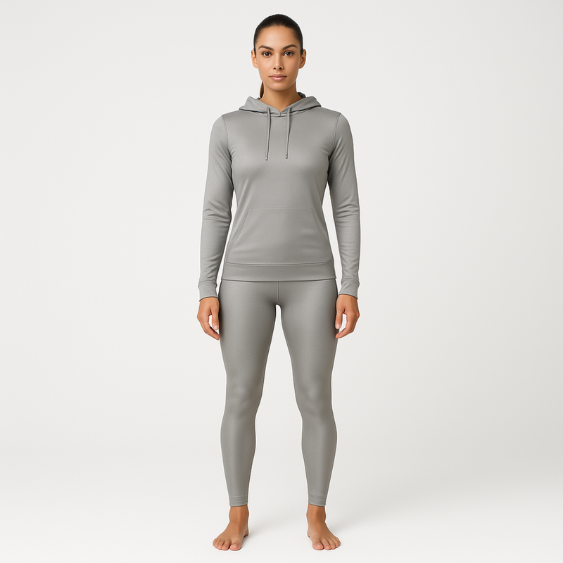 Woman wearing a grey silver gray emf 5g shielding hoodie on a white background